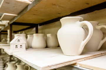 A pottery. A lot of different dishes that are ready for roasting.