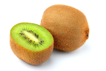 Fresh ripe kiwi fruit cut in half isolated closeup.