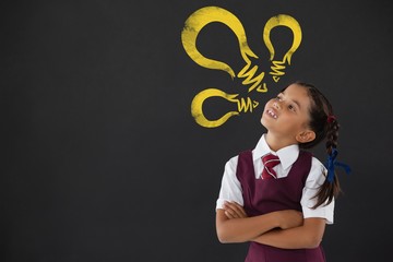 Composite image of digital composite image of yellow light bulb