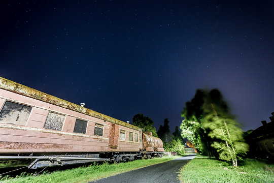 Rusty old train car with some stars in the sky