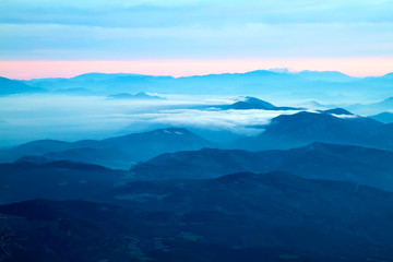far mountains with blue haze and clouds (sunset or sunset)