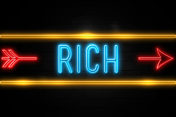 Rich  - fluorescent Neon Sign on brickwall Front view