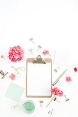 Flat lay home office desk. Clipboard with copy space for text, red flowers, accessories, mint diary on white background. Top view mock up women background.