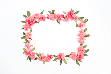 Floral frame with space for text made of pink hydrangea flowers, green leaves, branches on white background. Flat lay, top view. Floral background. Frame of flowers.