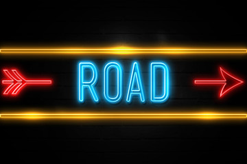 Road  - fluorescent Neon Sign on brickwall Front view