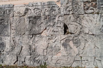 Reliefs of the players at the great ball game court at the archeological site Chichen Itza, Mexico.