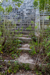 Steps to the ruins of Casa de la Vieja building in the ancient Mayan city Uxmal, Mexico