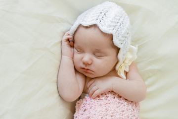Fototapeta na wymiar indoor portrait of adorable european newborn baby