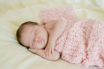 indoor portrait of adorable european newborn baby