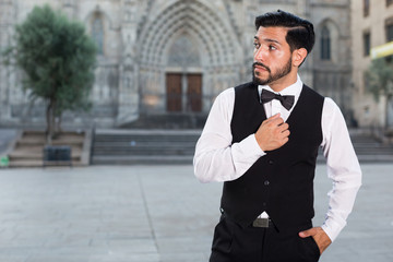 Portrait of man in bow tie outdoors
