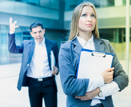 Female employee is upset  with the reprimand of boss