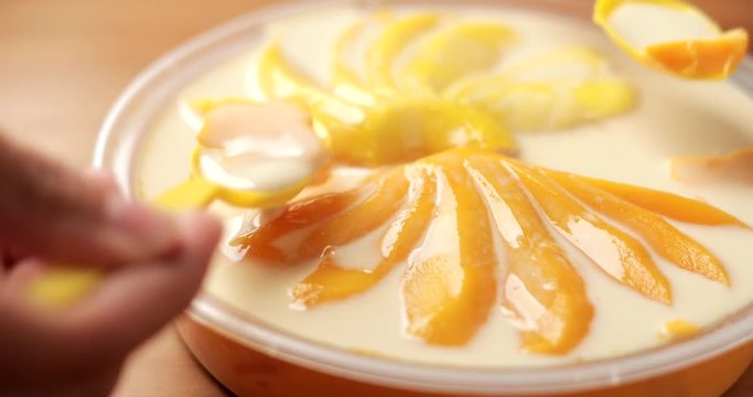 Eating mango pudding