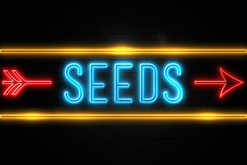 Seeds  - fluorescent Neon Sign on brickwall Front view