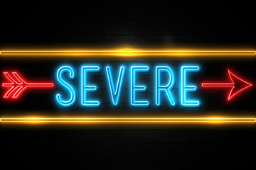 Severe  - fluorescent Neon Sign on brickwall Front view