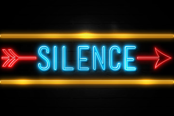 Silence  - fluorescent Neon Sign on brickwall Front view