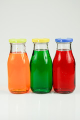 Fruit and vegetable juice bottles isolated on white background