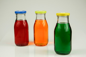 Fruit and vegetable juice bottles isolated on white background