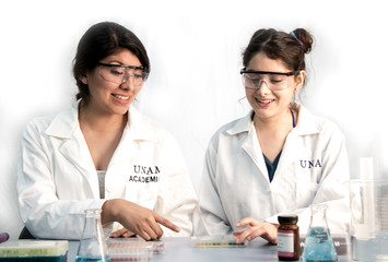 two young scientists preparing samples for further lab analysis