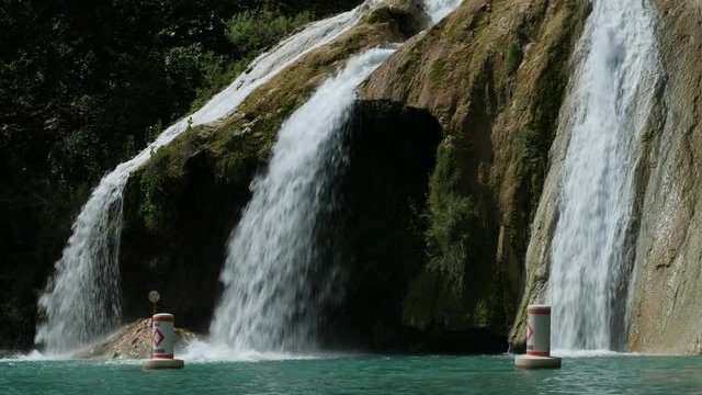 Steady close up shot, side view angle of Turner Falls on a bright sunny day 