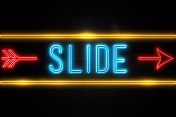Slide  - fluorescent Neon Sign on brickwall Front view
