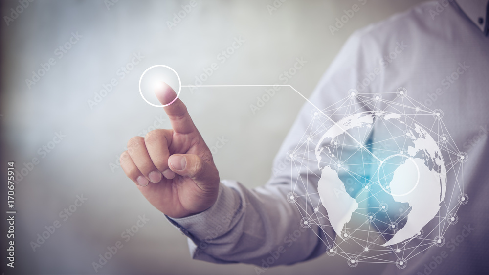 Aufkleber Businessman hand touching virtual button on Earth map point with network connection, international meaning