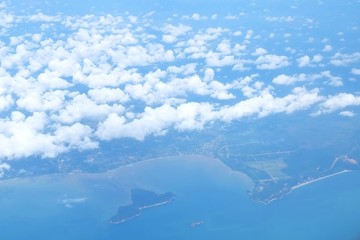 Clouds above the clear blue sky with seascape,