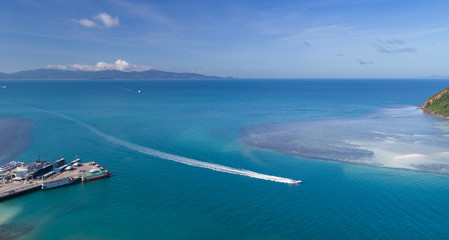 Aerial view of Koh Phangan international port with boats in the clear blue sea