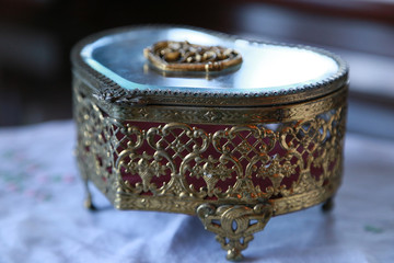 Container of the heart-shaped accessories on the table