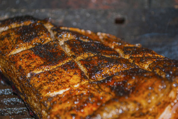 pork ribs marinated grilling on hot burning charcoal barbecue close-up