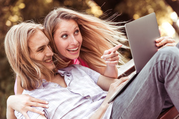 Couple watching funny videos on a laptop