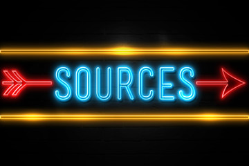 Sources  - fluorescent Neon Sign on brickwall Front view