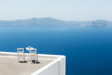 Two chairs on the terrace with sea view.