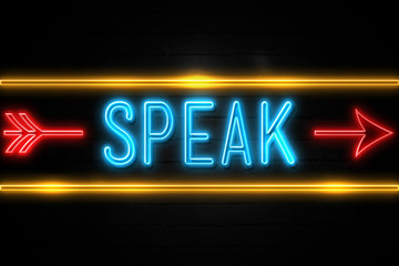 Speak  - fluorescent Neon Sign on brickwall Front view