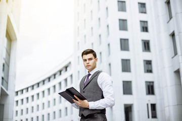 Successful businessman portrait outdoor in a modern city on a Sunny day