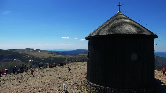 Religion building on the top of the mountain - people relax around 