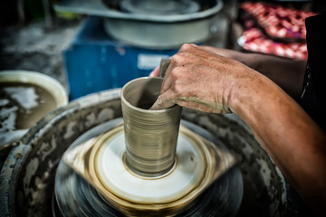 Man's hands. Potter at work