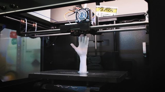 3D printer at work, 3D printer print the human hand, 3D printer print the whiter human hand, Hand Shape Product Printed With 3d Printer