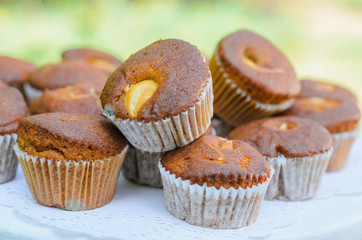 the tables with the desserts . decorated plates of cookies , biscuits. A wedding Banquet . Extra pounds and calories . Sweets of various kinds