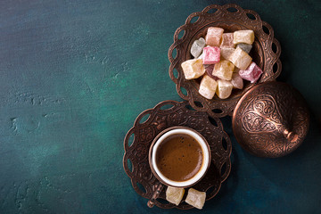 Traditional turkish coffee  and turkish delight on dark green wooden background. flat lay - 170683994