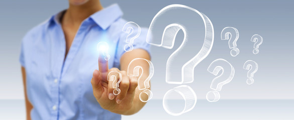 Businesswoman touching hand drawn question marks