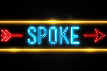 Spoke  - fluorescent Neon Sign on brickwall Front view