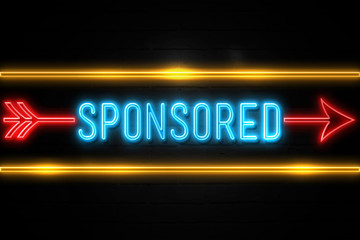 Sponsored  - fluorescent Neon Sign on brickwall Front view