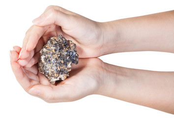 top view of zinc and lead mineral ore in handful