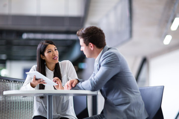 Colleagues in an informal business meeting using a digital tablet