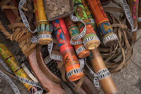  indigenous quechua crafts made of wood  selling on the street in the Saturday market