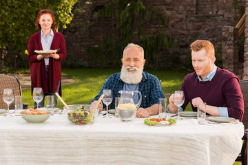 happy men sitting at table