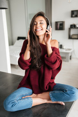 Happy cheerful asian woman in headphones