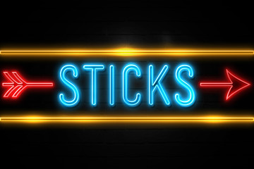 Sticks  - fluorescent Neon Sign on brickwall Front view