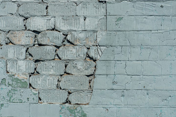 Old  wall with painted and shabby uneven plaster. Cracked Brick Wall Background.  Vintage Brickwork Structure With Peeled Plaster.  Brick Wall With Damaged Shabby Color Plaster Square Background.