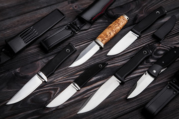 Knives on a wooden background
